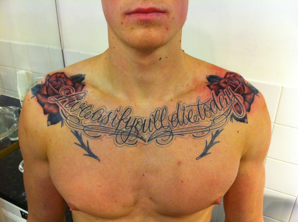 Posted in Tattoos with tags black and grey roses chest tattoo script 